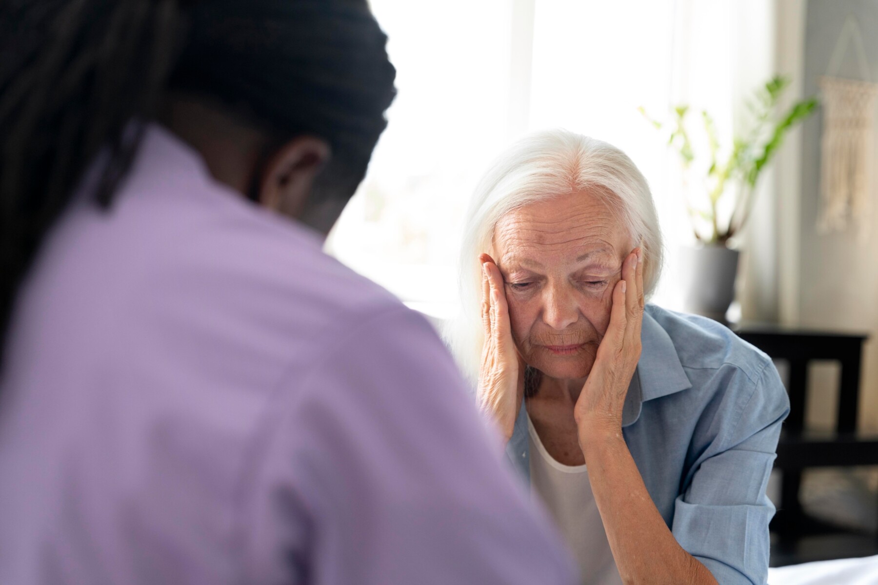 african-social-worker-taking-care-senior-woman-scaled.jpg